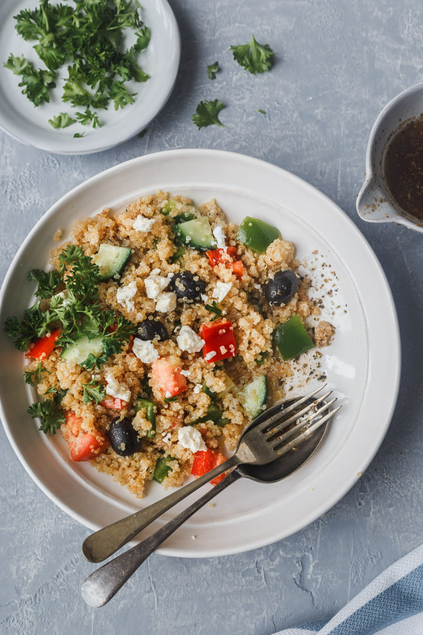 mediterranean quinoa salad with date vinaigarette on a bowl