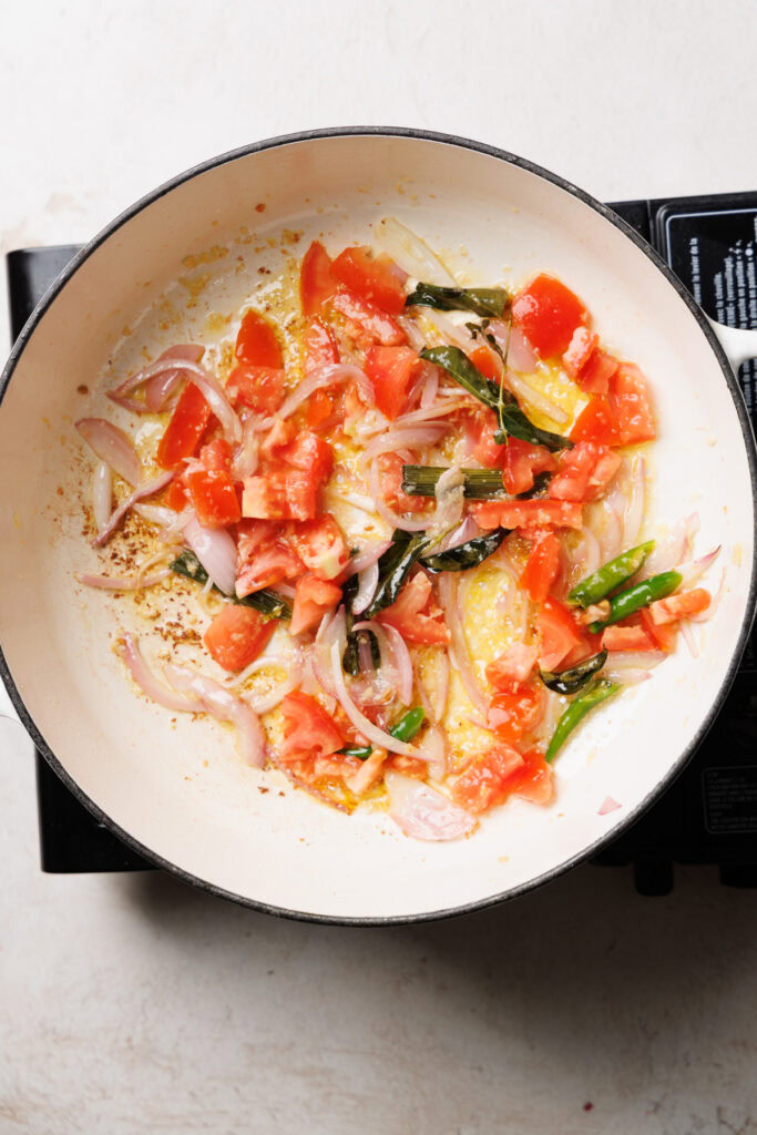 cooking tomatoes in the pan.