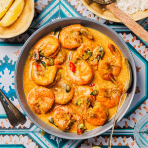 sri lankan prawn curry in a blue bowl.
