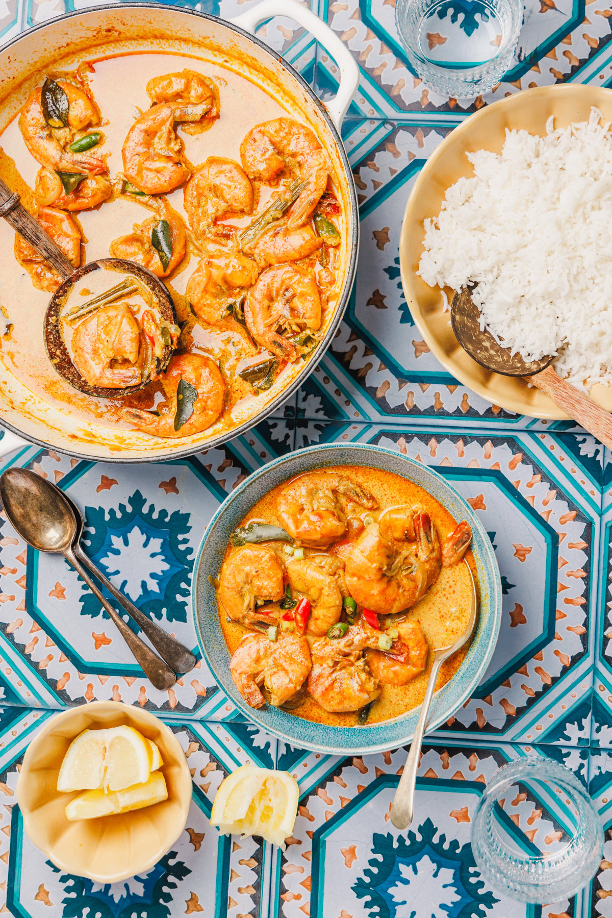 Sri Lankan prawn curry with rice on a blue background.