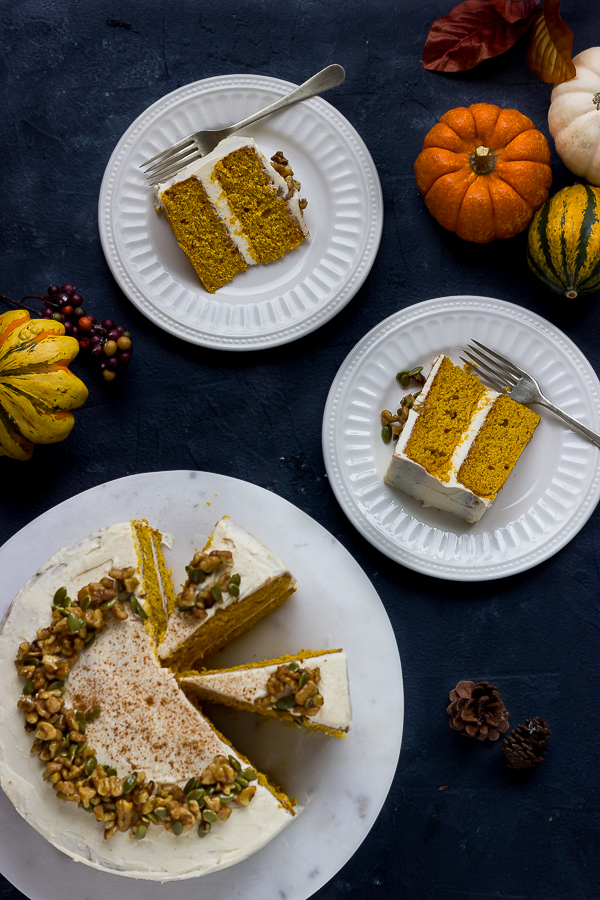 GF pumpkin layer cake with cream cheese frosting on plates