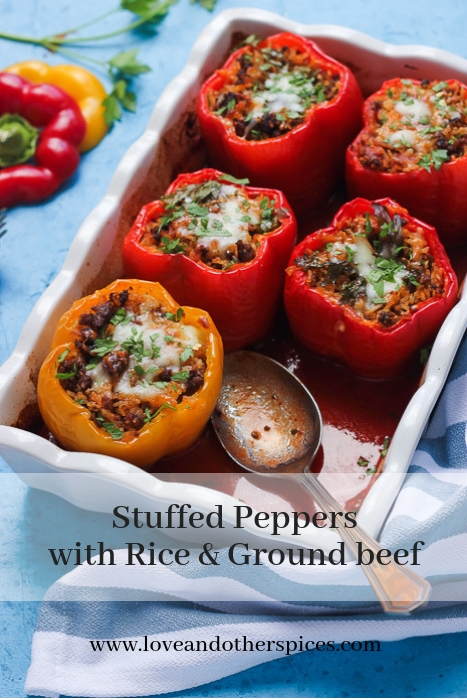 stuffed peppers with rice and ground beef in a baking dish