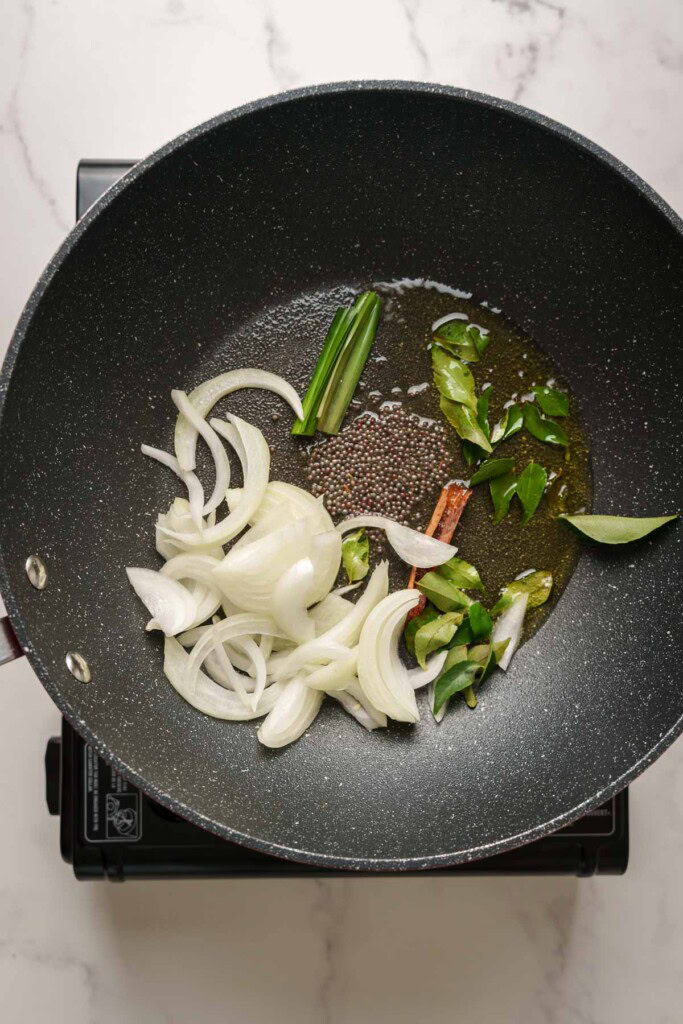 sauteing aromatics in a pot.