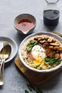 savory oatmeal topped with poached egg,sauteed mushrooms and scallions