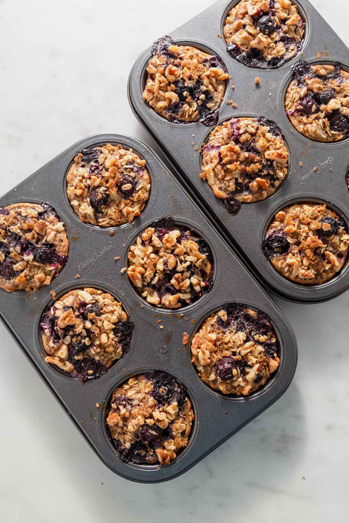 baked blueberry oatmeal cups in the muffin pan.