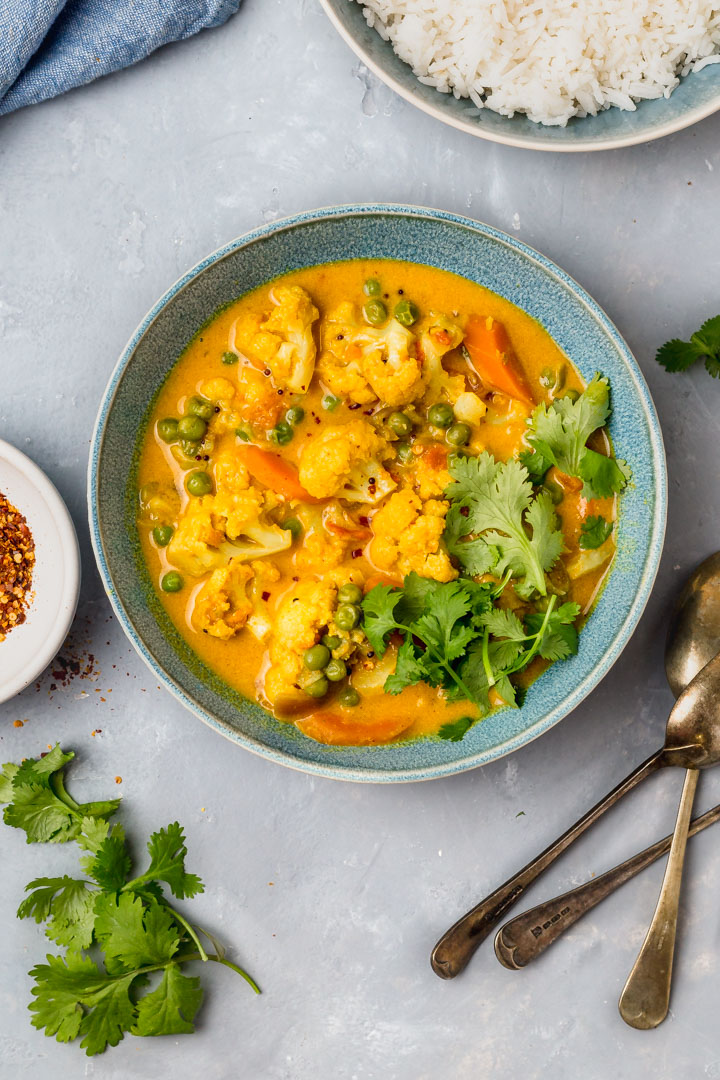 cauliflower coconut curry in a bowl with rice