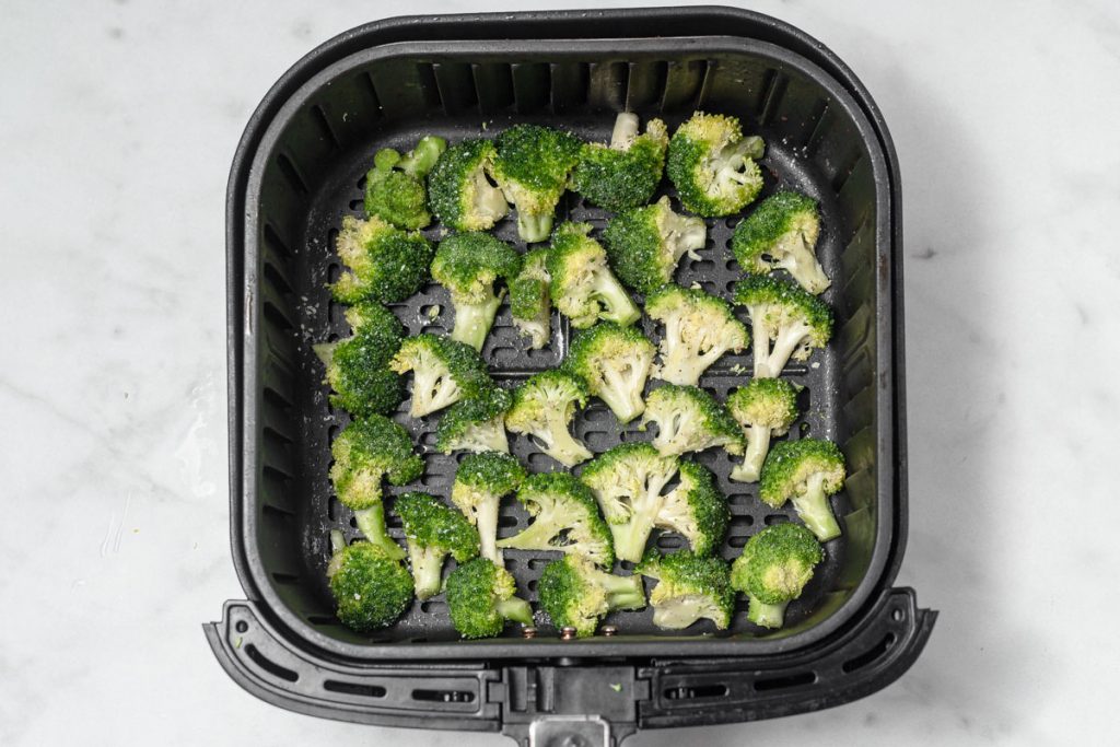 cut broccoli florets in the sir fryer basket