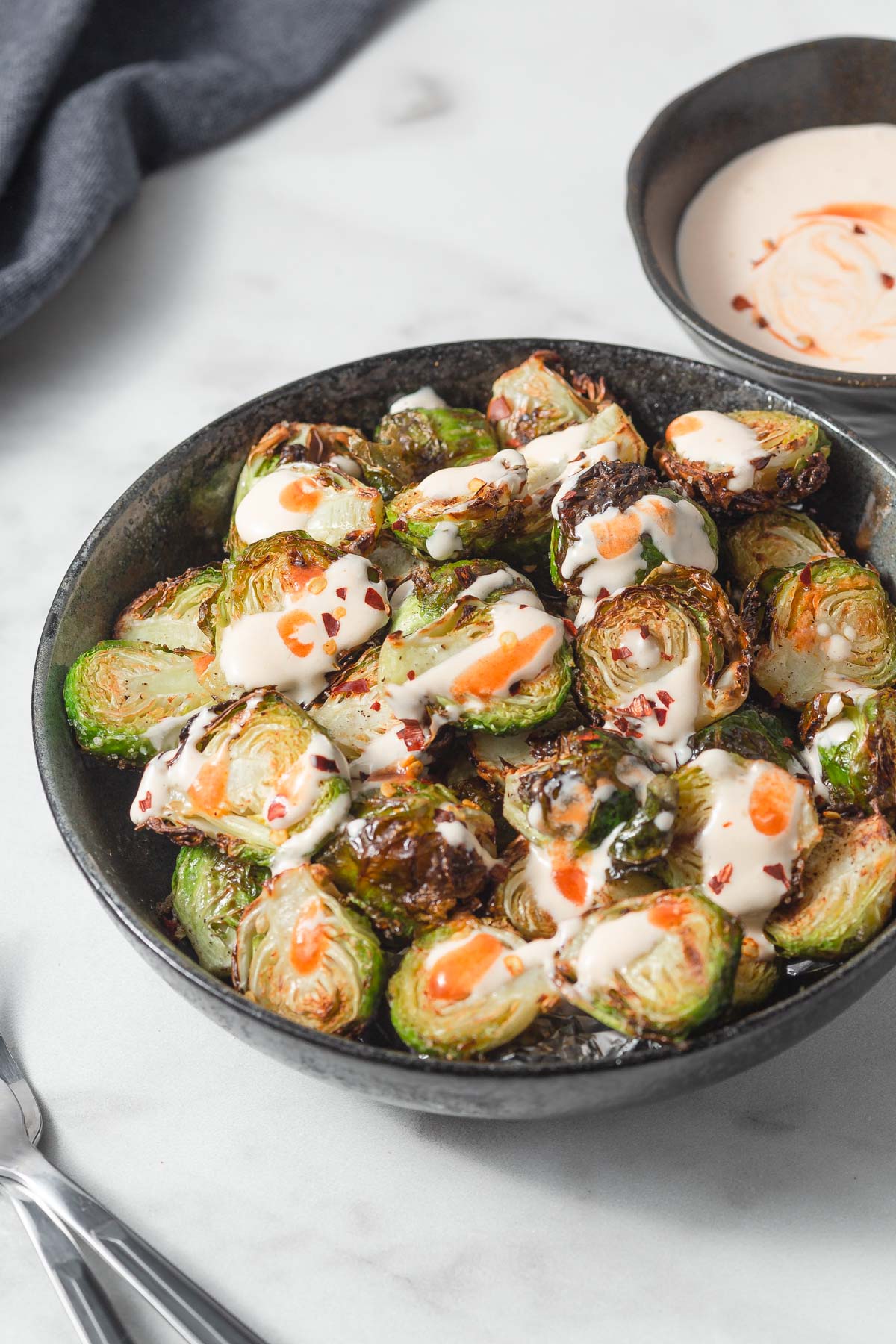 air fryer brussel sprouts with a spicy mayo sauce 