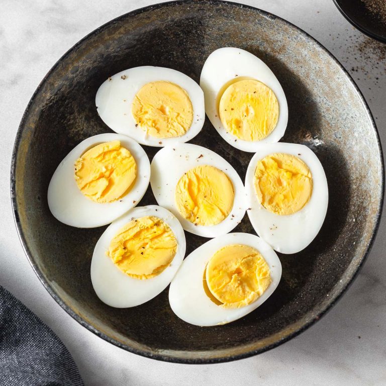 instant pot hard boiled eggs on a plate with a sprinkle of black pepper