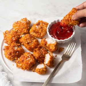 air fryer chicken nuggets dipped in ketchup