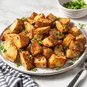 air fryer roast potatoes in a plate with parsley