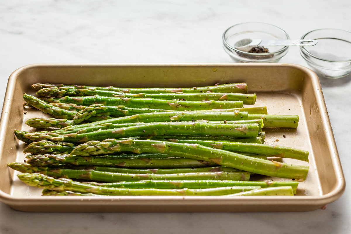 asparagus coated with oil, salt and pepper