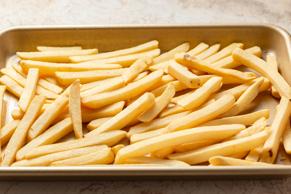 frozen frech fries on a baking sheet