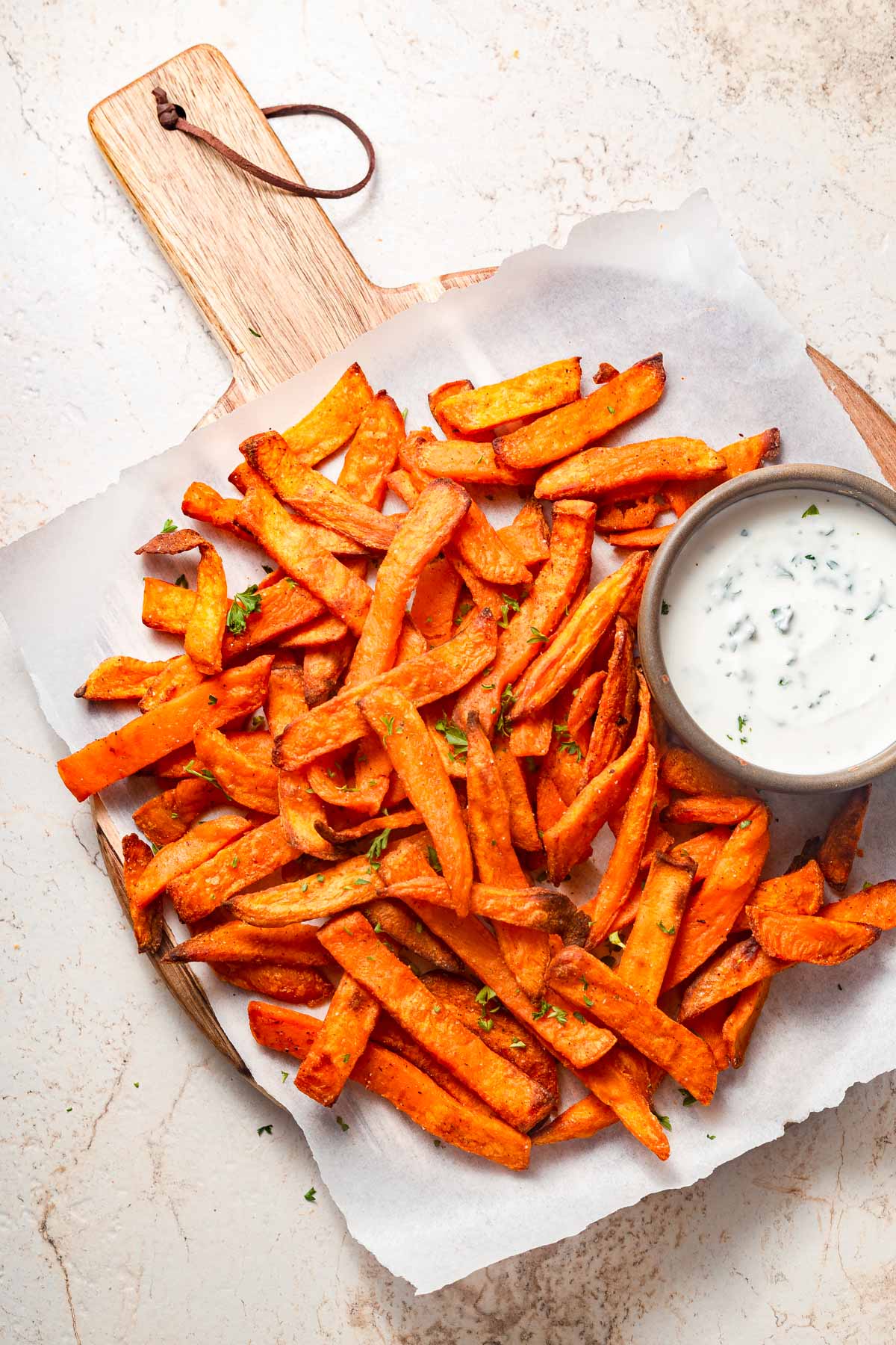 frozen sweet potato is air fried and presented with a dip.