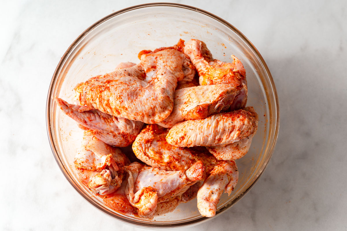 marinated chicken wings in a bowl.