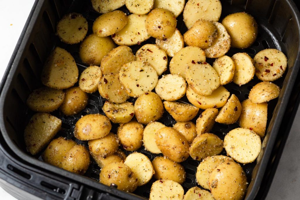 air fryer potatoes in the air fryer basket.