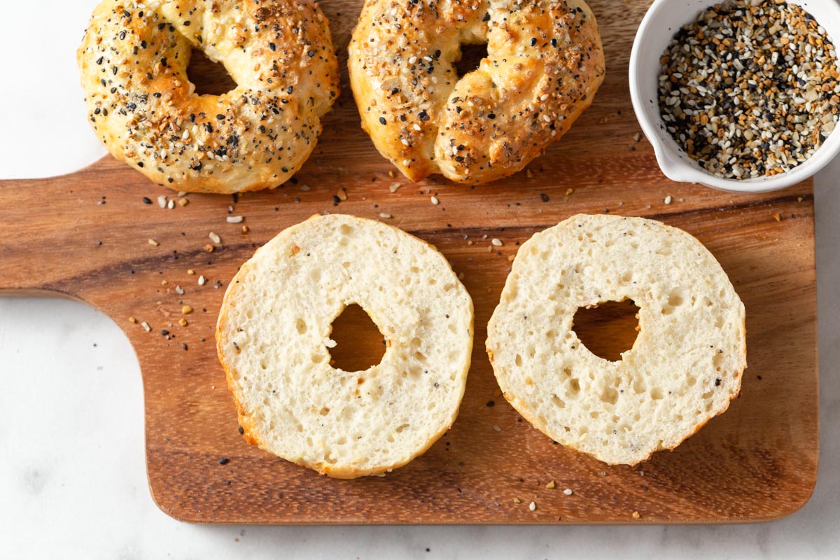 air fryer bagels cut in two showing the texture.