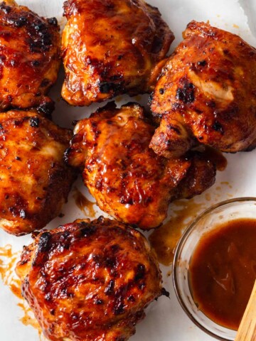 air fryer bbq chicken thighs with barbecue sauce.