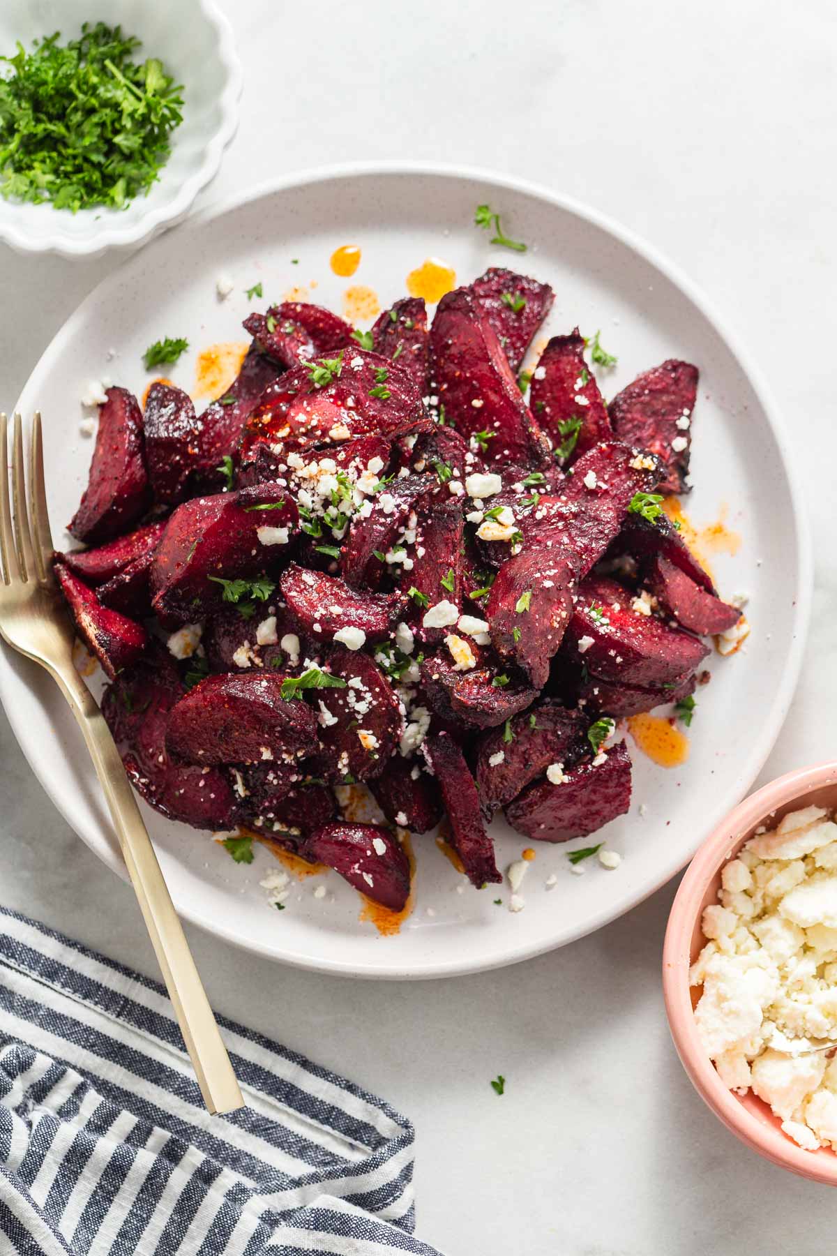 air fryer roasted beets on a plate with feta cheese.