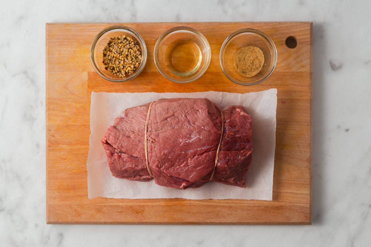 ingredients for air fryer roast beef on a chopping board.