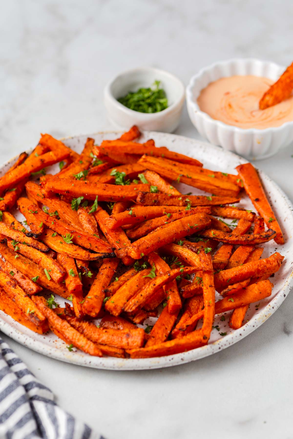 air fried carrot fries with dip and parsley.