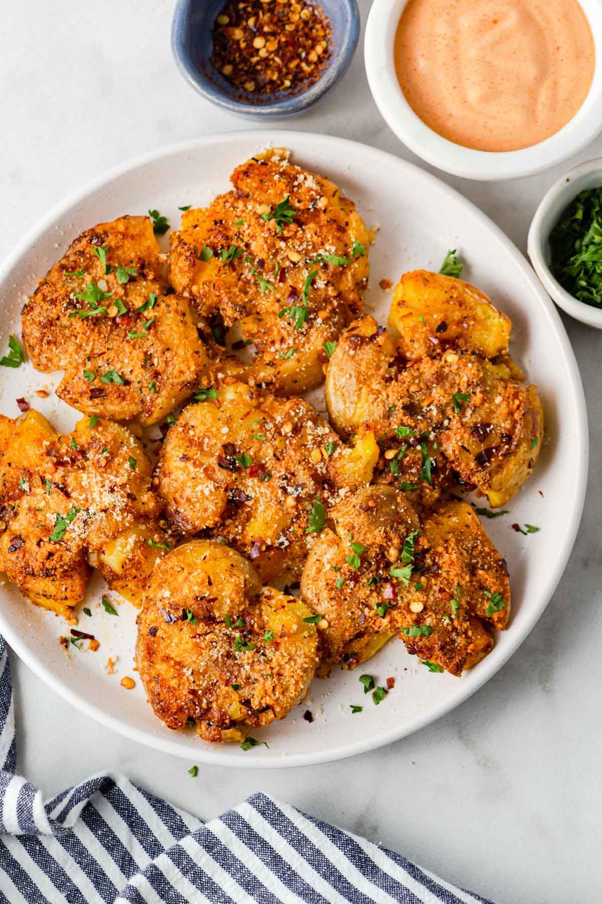 crispy air fryer smashed potatoes on a plate.