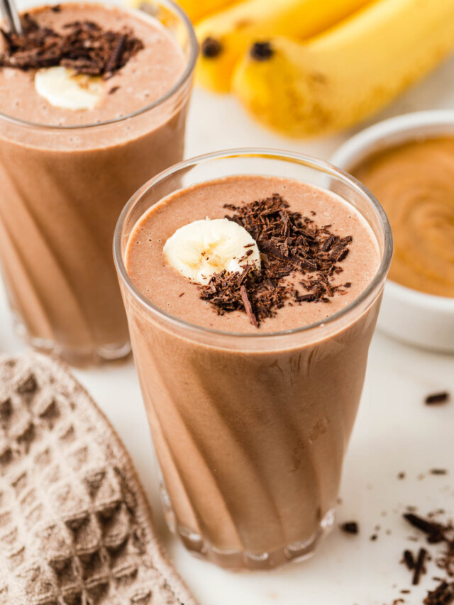 chocolate peanut butter banana smoothie in a glass.