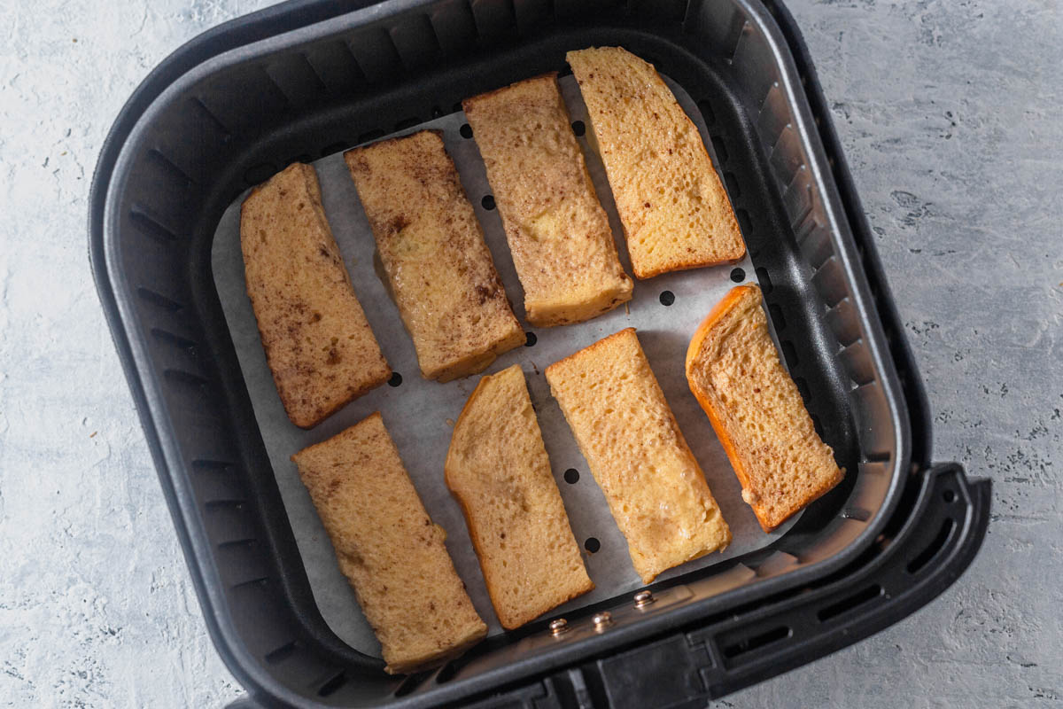 French toast sticks in the air fryer basket.