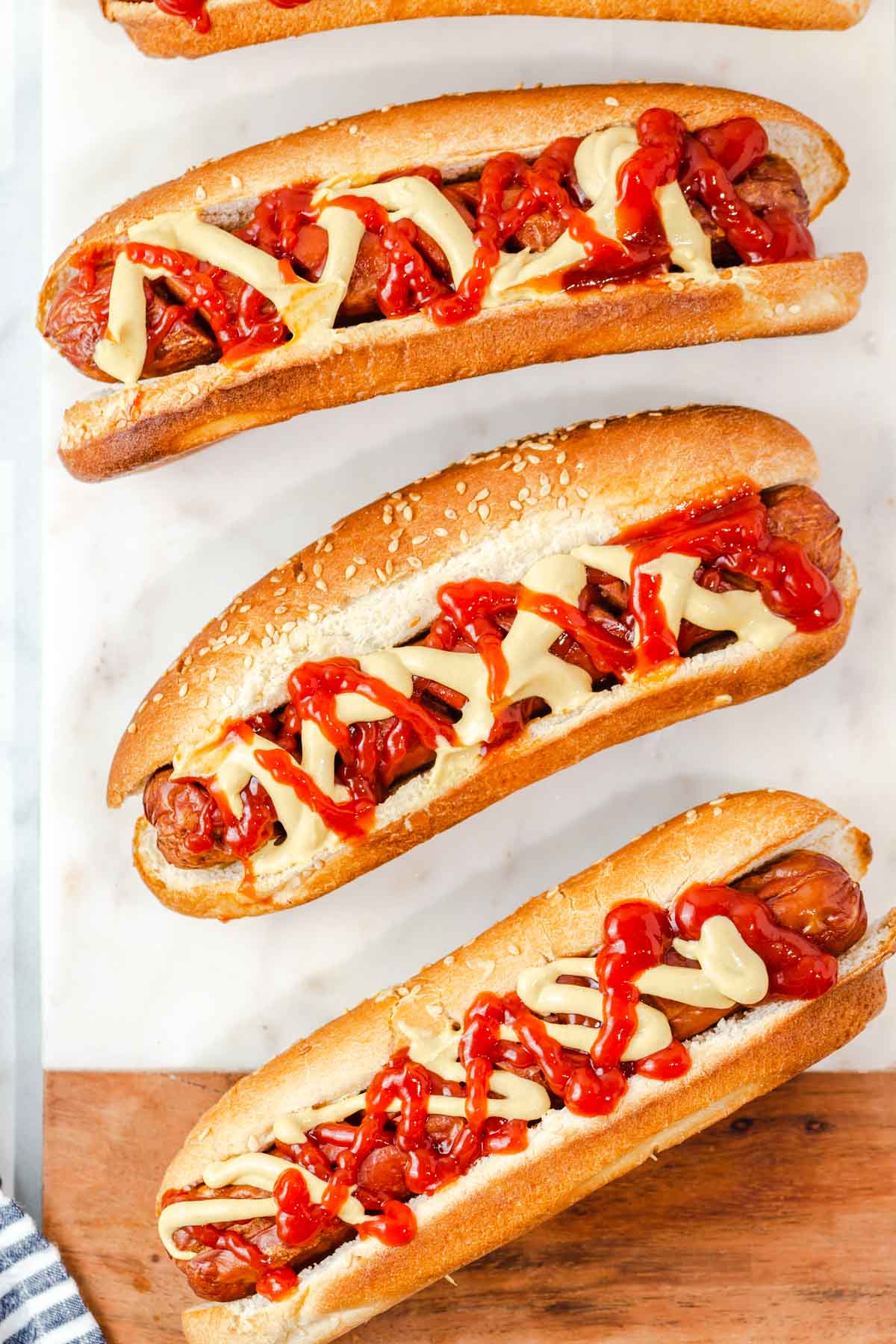 air fryer hot dogs with mustard and ketchup.
