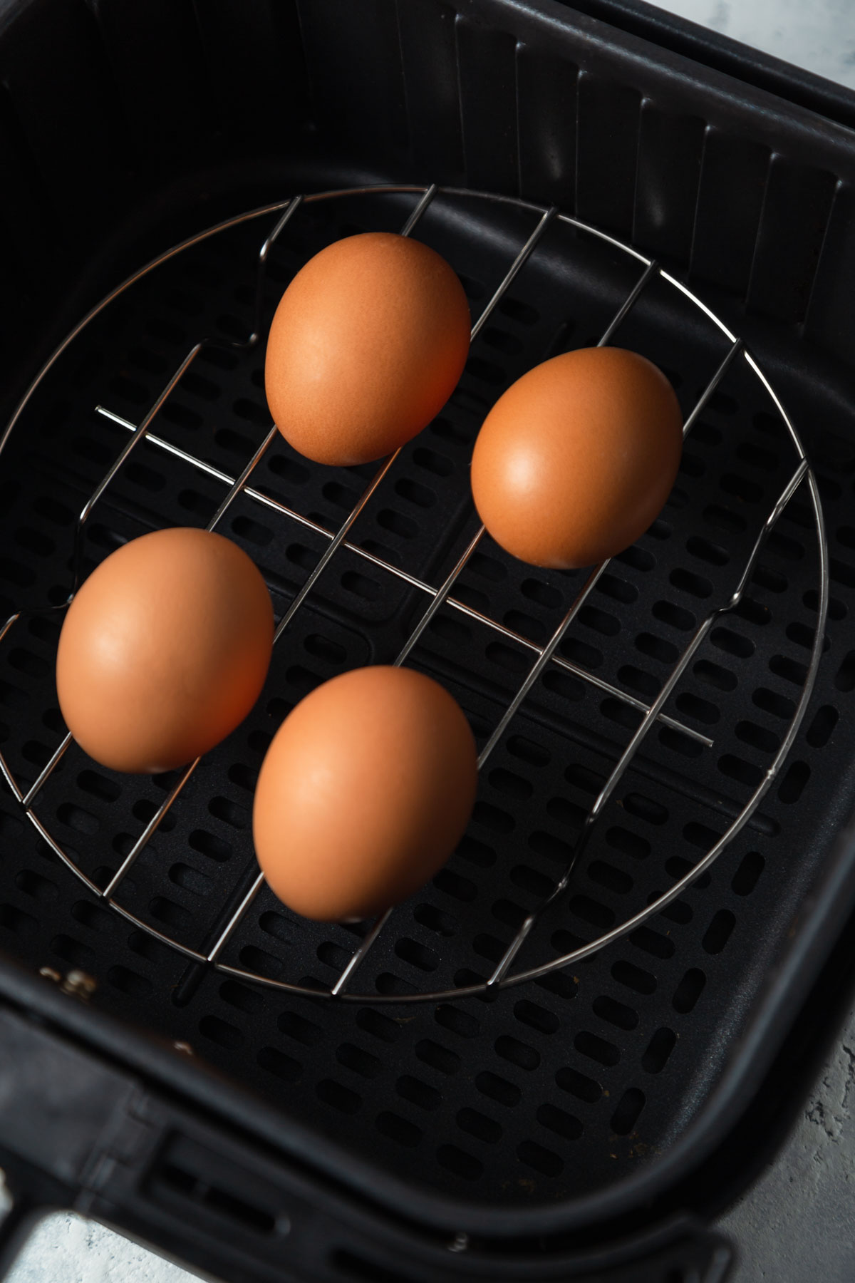 eggs in the air fryer basket.