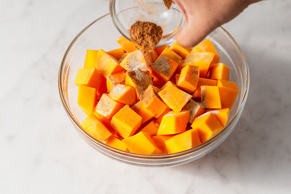 adding cinnamon butternut squash cubes.