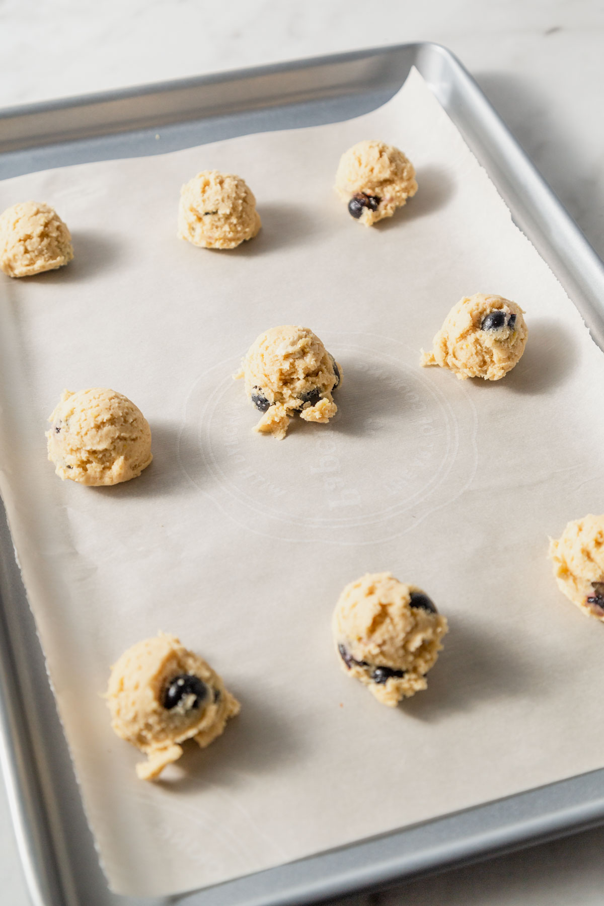 cookie dough on the baking sheet.