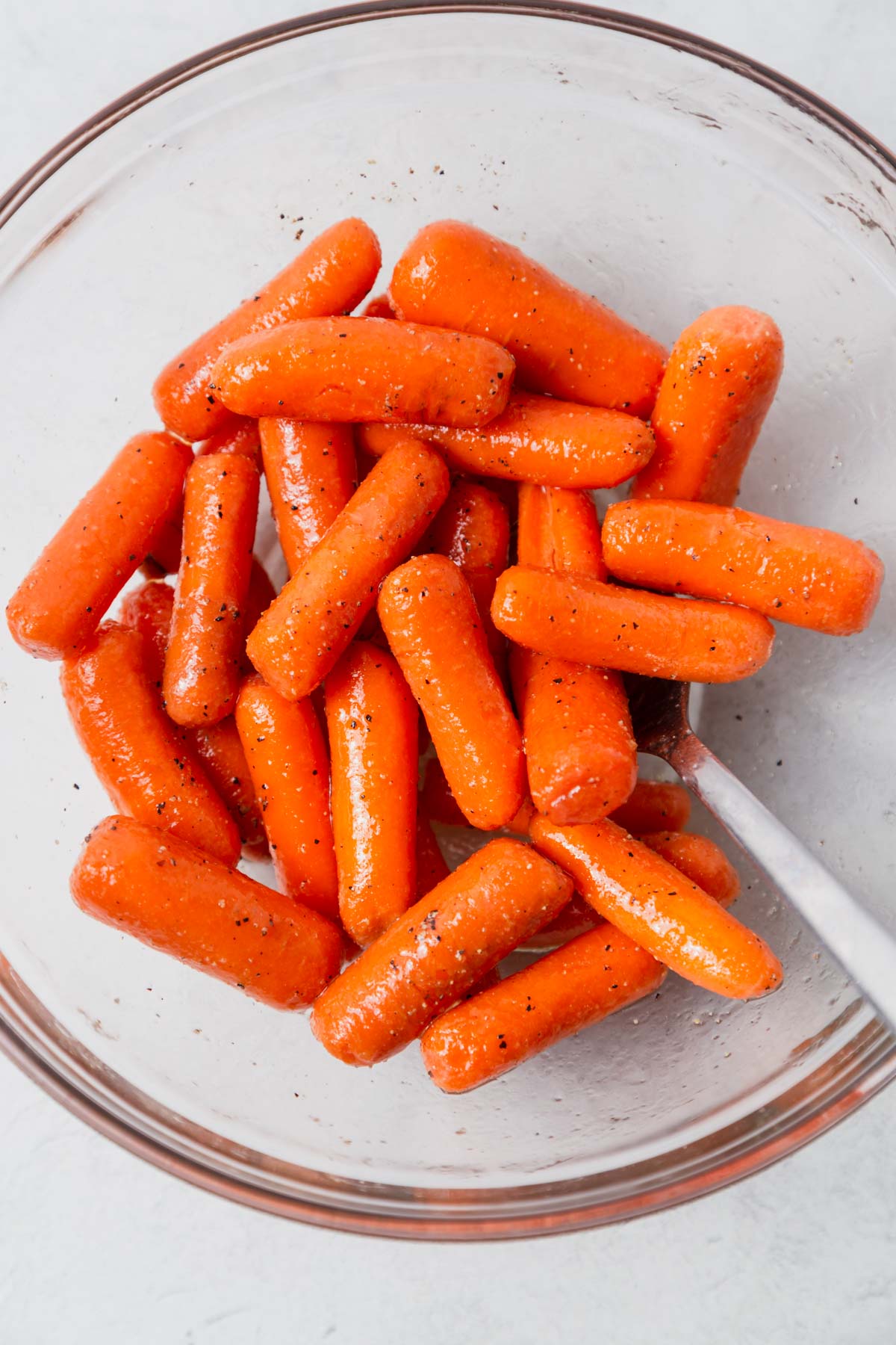 seasoned air fryer baby carrots in a bowl.