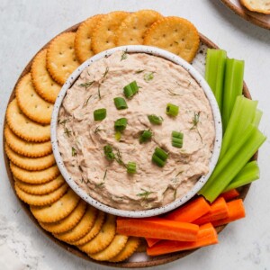 canned tuna with crackers and vegetables.