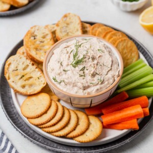 canned salmon dip with vegetables, crostini and crackers.