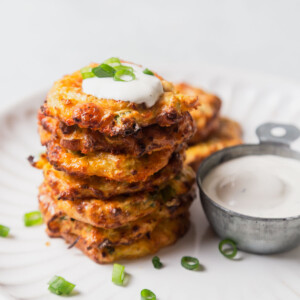 air fry zucchini fritters with sour cream and green onions.