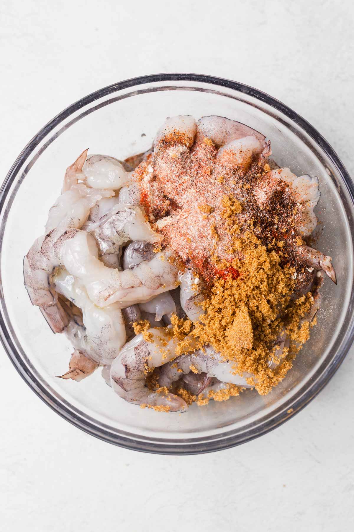 shrimp and seasonings in a bowl.