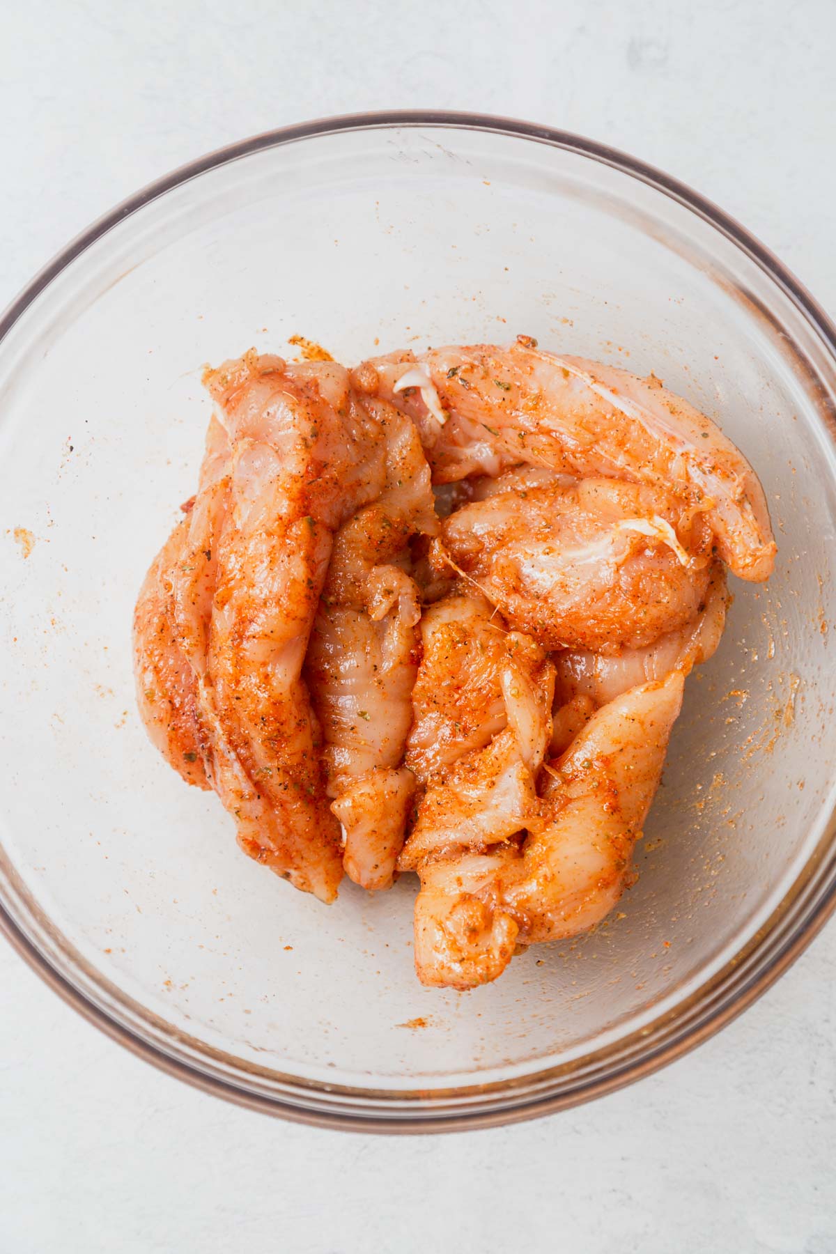 seasoned chicken tenders in a bowl.