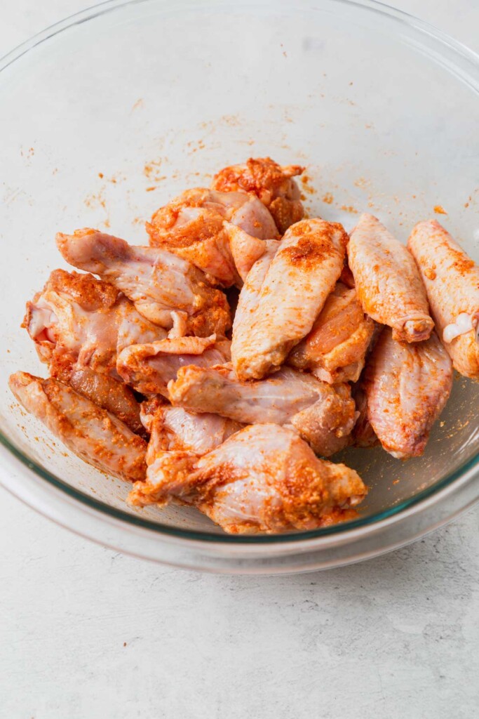 seasoned chicken wings in a bowl.