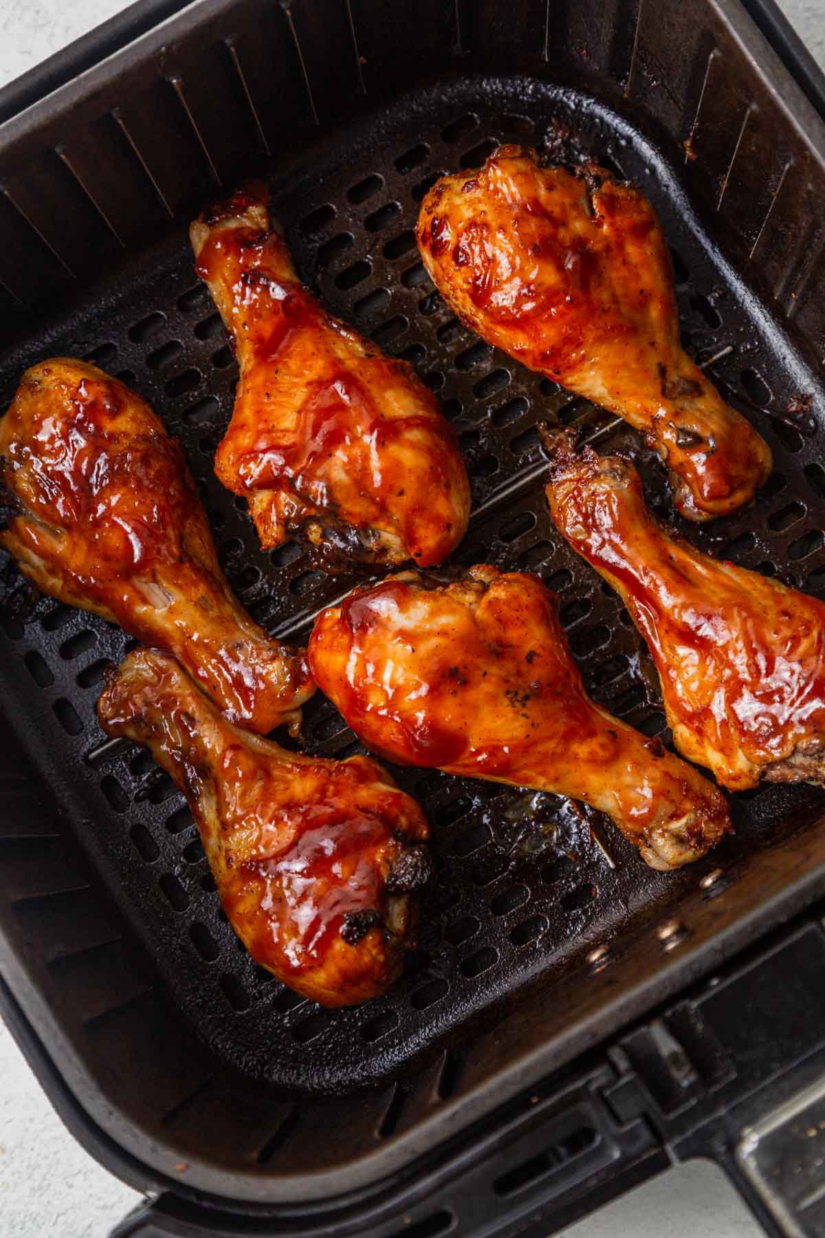 coated chicken legs in the air fryer.