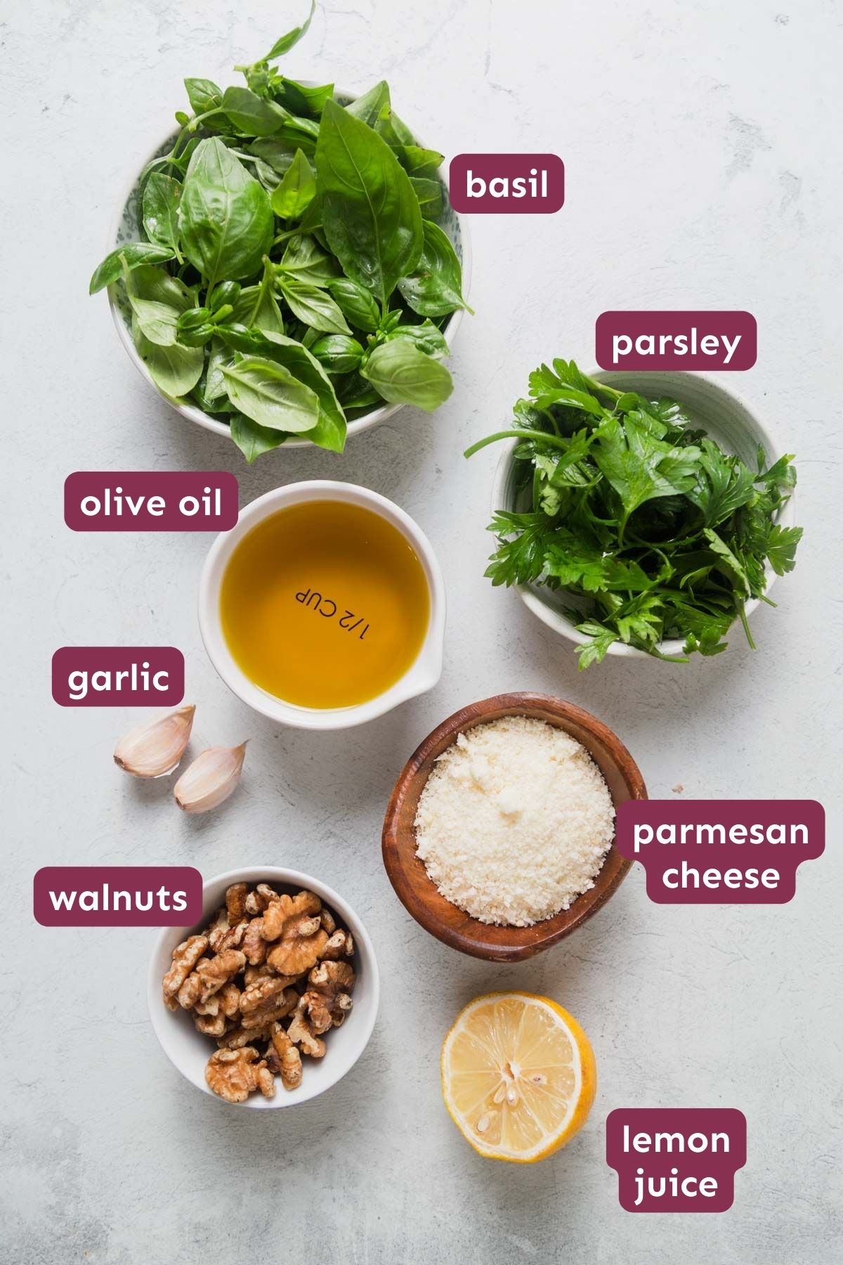 ingredients for pesto without pine nuts on a white background.