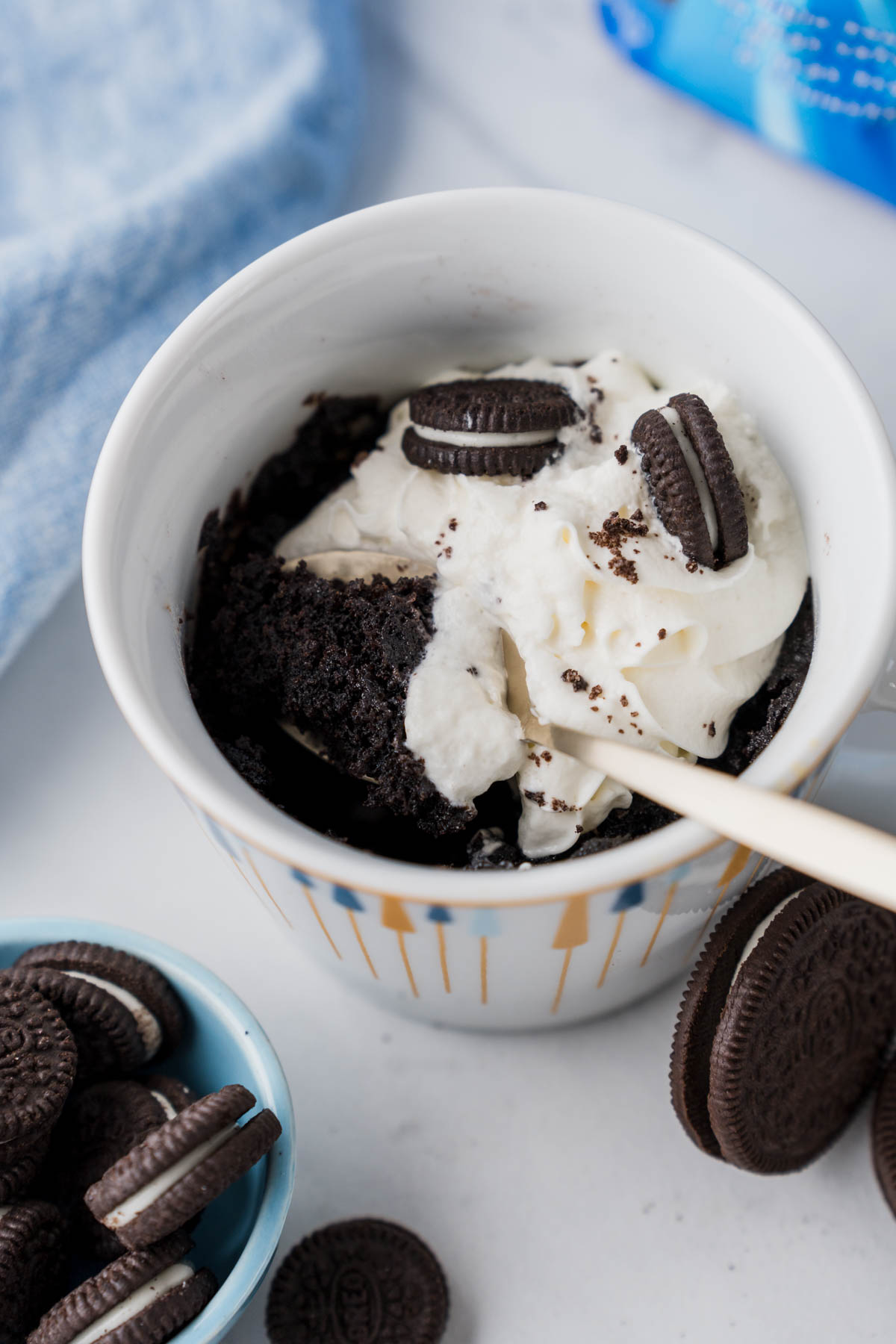 oreo mu cake is being scooped with a spoon.