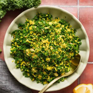kale mallum in a bowl on a tiled background.