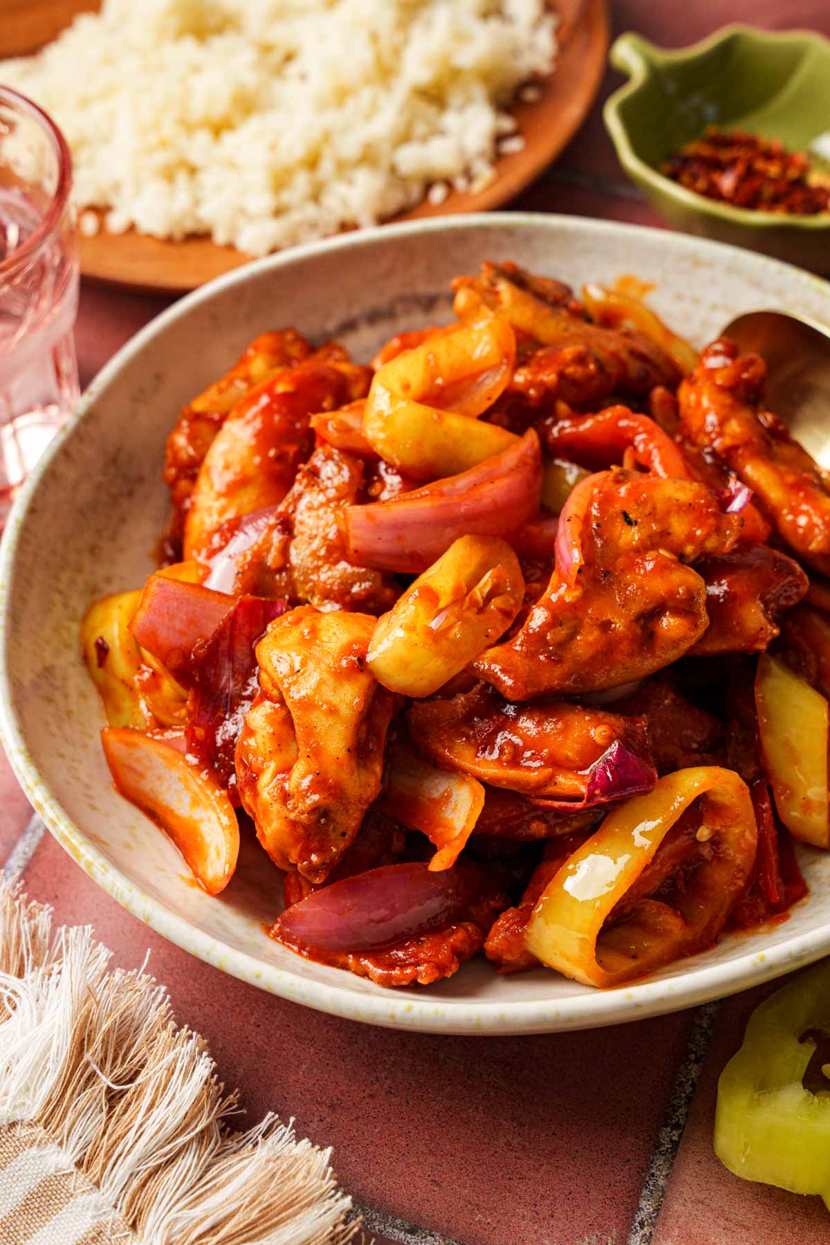 sri lankan devilled chicken on a bowl.