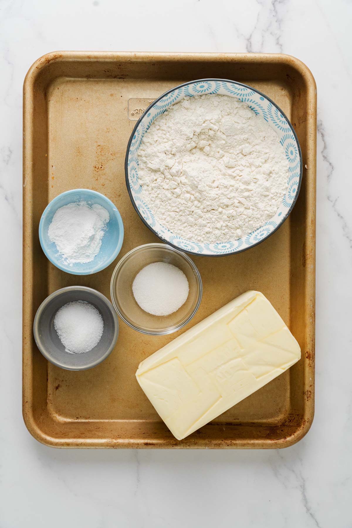 sri lankan chicken patties dough ingredients on a tray.