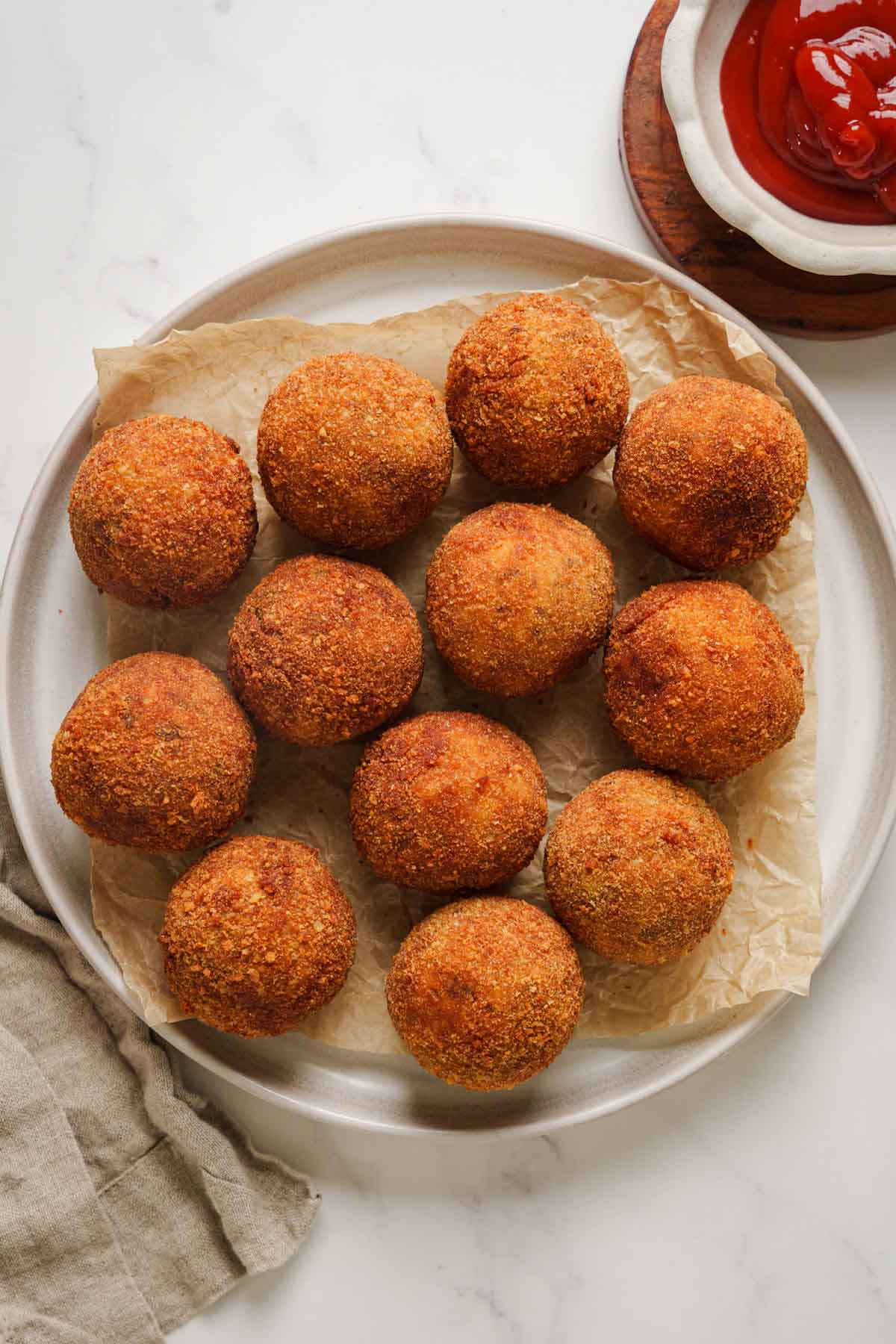 sri lankan tuna cutlets on a plate.