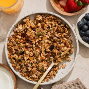 air fryer granola on a plate with a spoon.
