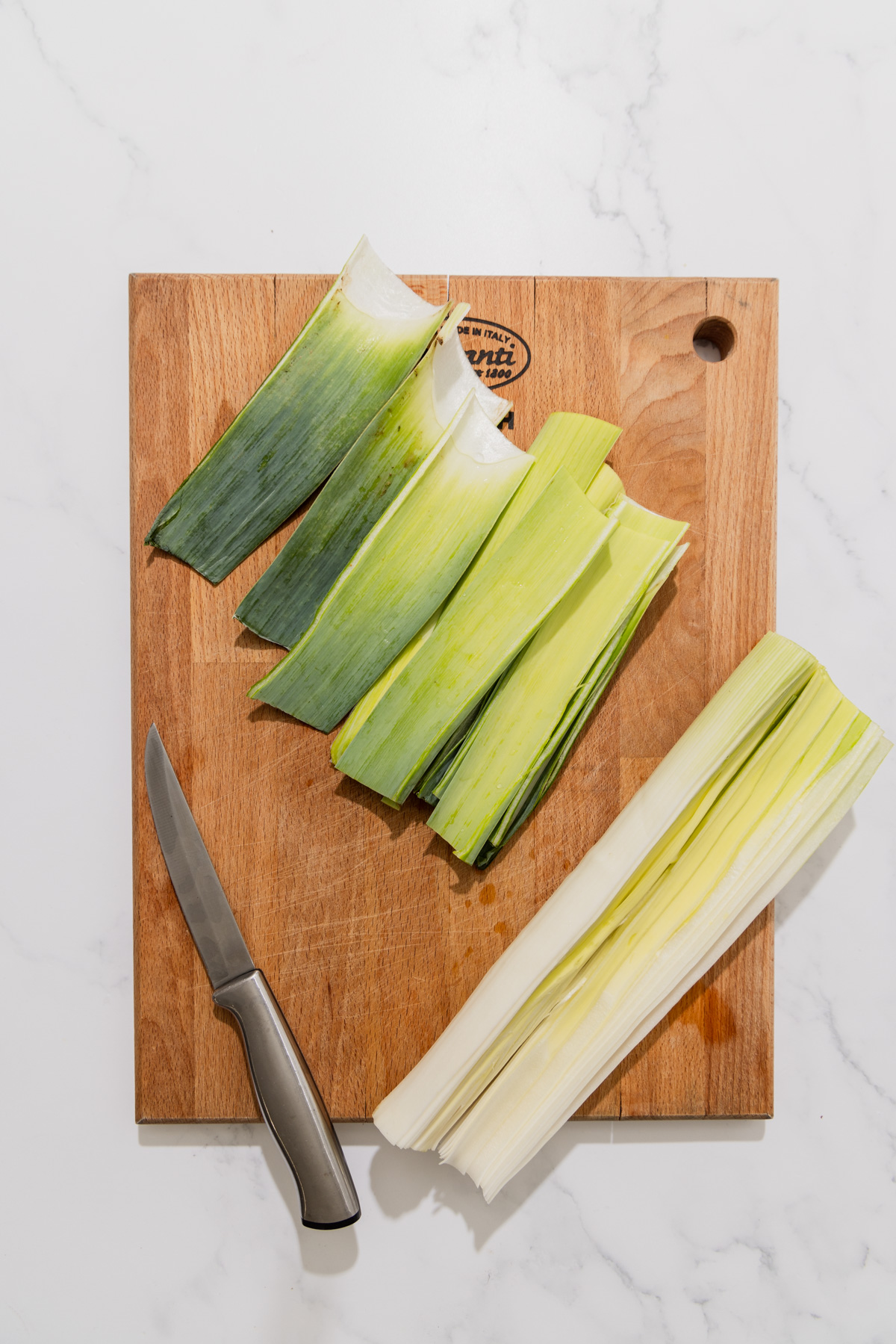cut leeks on a cutting board.