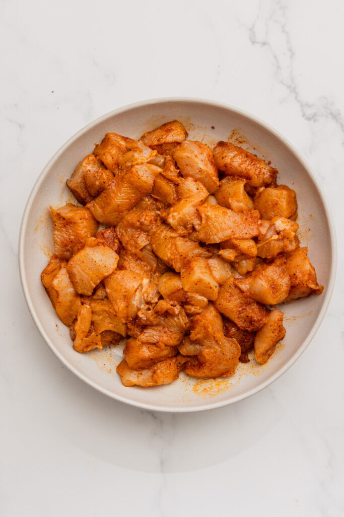 marinated chicken cubes in a bowl.