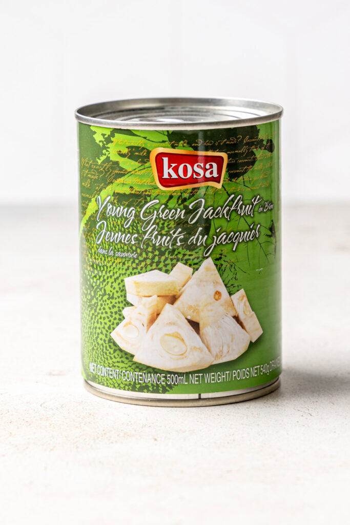 Can of jackfruit on a white surface.